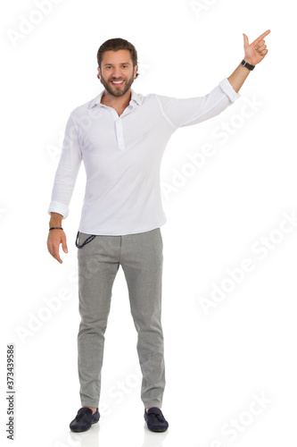 Handsome Man Is Standing With Arm Raised And Directing