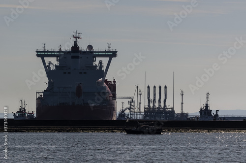 LNG TANKER - Ship is maneuvering to moor at the gas terminal