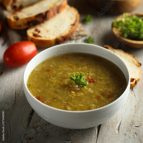 Traditional homemade lentil soup with fresh parsley