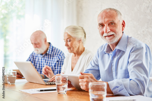 Senior man in computer course at retirement home