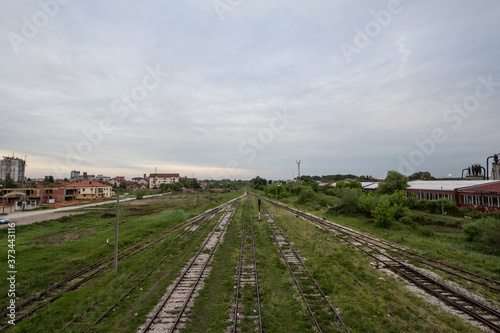 Abandoned train station in Brcko with old platforms and rusted rails. Brcko is a city in Bosnia, near the border with Croatia