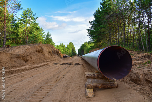 Construction Gas Pipeline Project. Natural Gas and Crude oil Transmission in pipe to LNG plant (shipped by LPG tanker). Building of transit petrochemical pipe in forest area. Pipes Welding