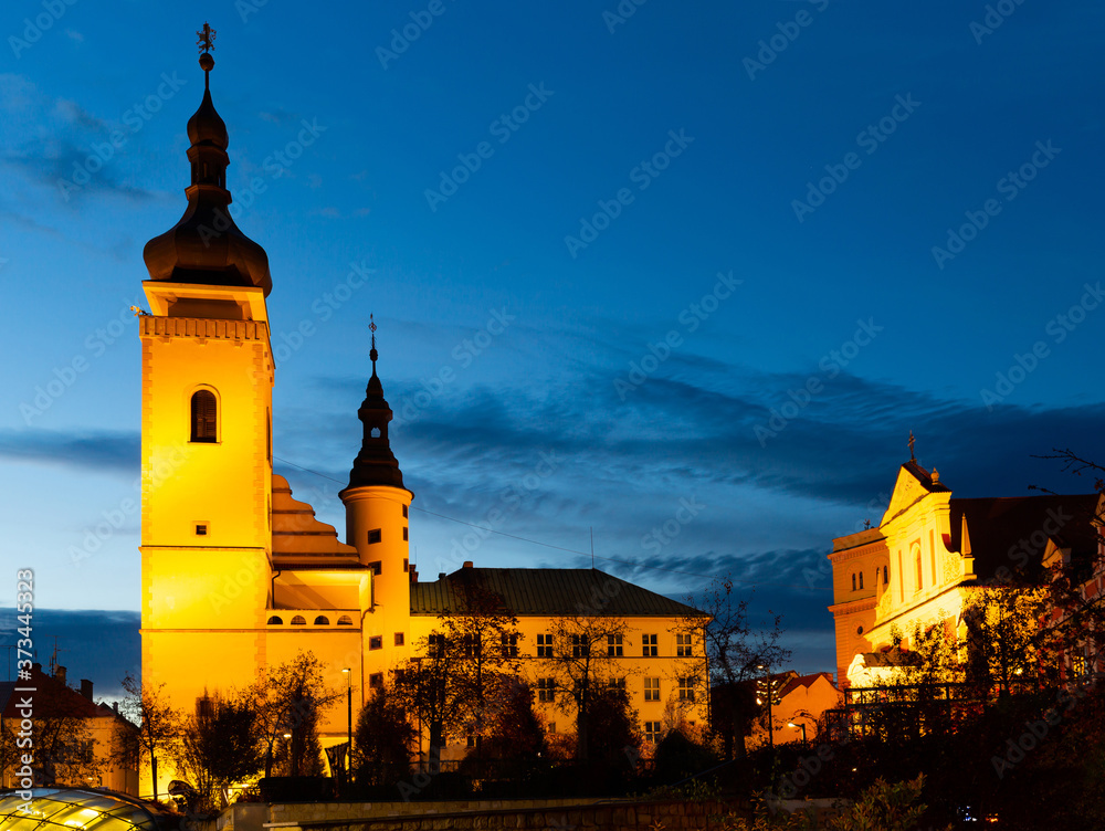 Picturesque night view of historical center of Mlada Boleslav overlooking Old Town Hall and Church of Assumption of Blessed Virgin Mary, Czech Republic