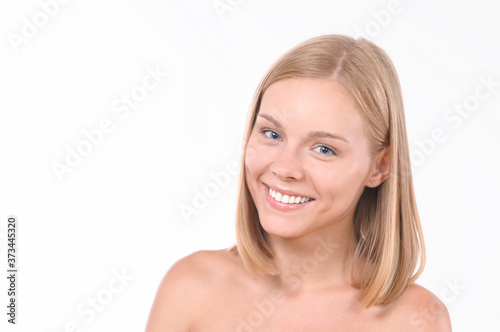 Pretty smiling joyfully female with blonde hair