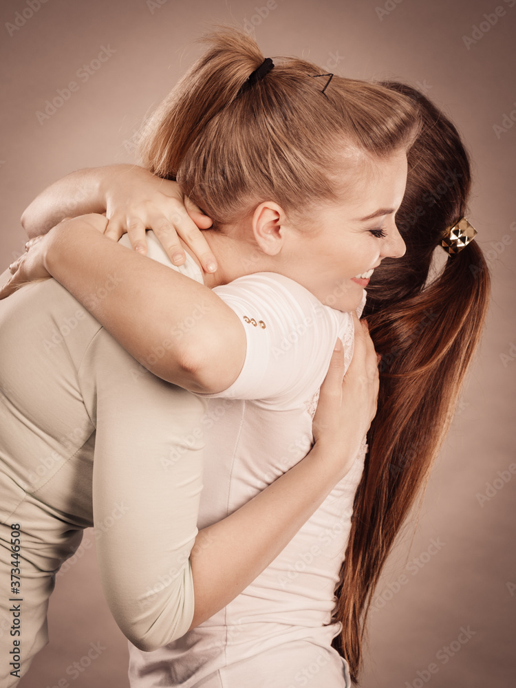 Two happy friends women hugging Two happy friends women hugging