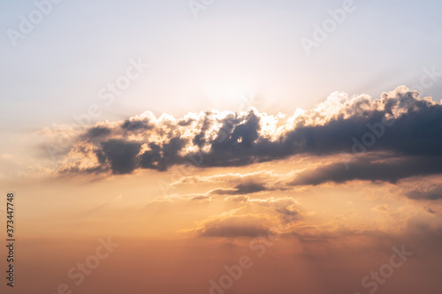 Sunset / sunrise with thunderclouds. Clouds in the rays of sunlight. Sunset Dawn. A natural phenomenon. Weather forecast.