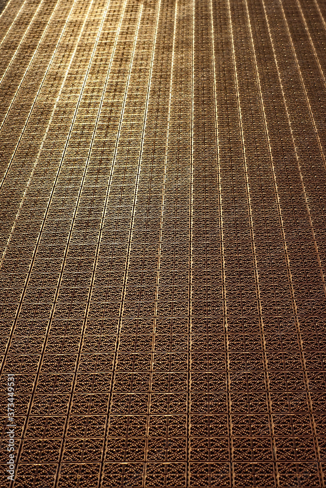Obraz premium Red rubber coating for basketball and sports grounds. Texture of artificial floor close up.