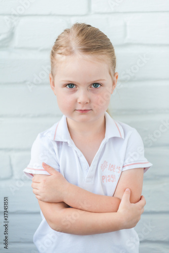 Cheerful smiling baby girl portrait on a white wall background Free Download Cheerful smiling baby girl portrait on a white wall background - GFXLoad