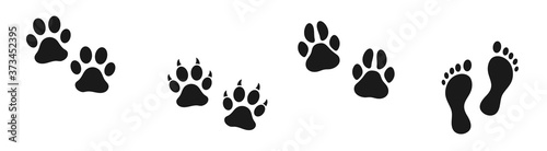 Set of human and animal footprints. Bare human feet. Cat and dog trace. Pet store icon. Steps.