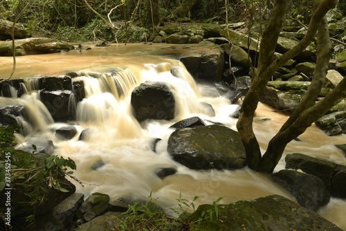 Man Fah waterfall after heavy rainfall in deep forest at Thap Lan National Park, Thailand. photo