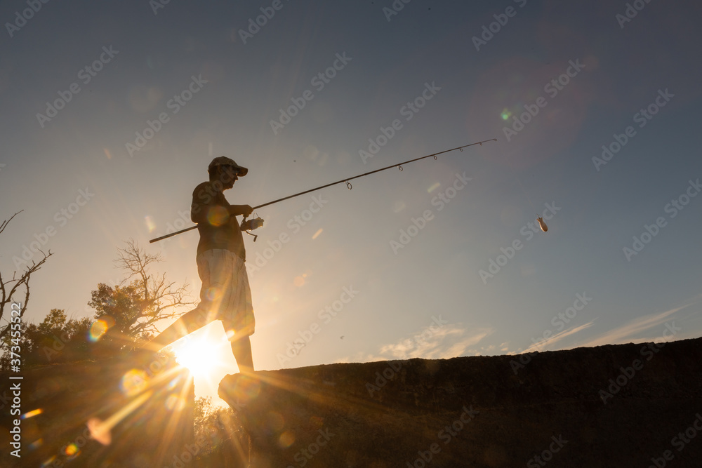 river fisherman with fishing rod
