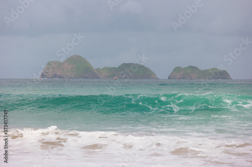 View of a beautiful islands at Red Island beach at Sumberagung, Indonesia photo