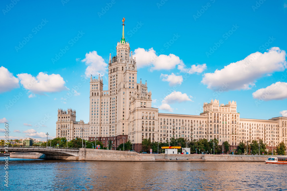 Moscow / Russia - 15 Aug 2020: Panorama of the famous high-rise building in Moscow against the blue sky in Kotelnicheskaya embankment, river walks and tourist season