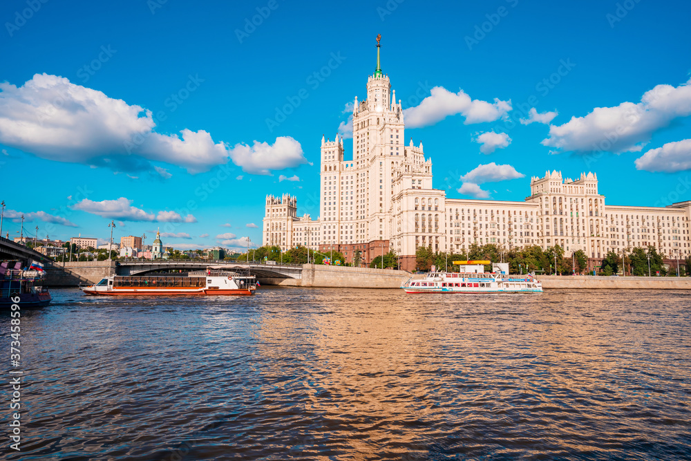 Moscow / Russia - 15 Aug 2020: Panorama of the famous high-rise building in Moscow against the blue sky in Kotelnicheskaya embankment, river walks and tourist season