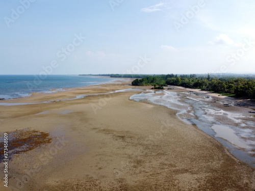 Aerial view of the coast line of teluk lombok beach, East Kalimantan, Indonesia at low tide.