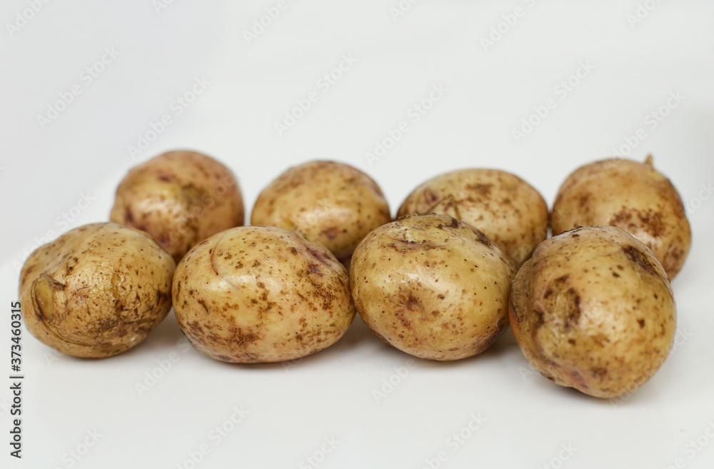 Boiled potatoes for cooking dinner with mushrooms, onions and parsley in a frying pan with oil Boiled potatoes for cooking dinner with mushrooms, onions and parsley in a frying pan with oil