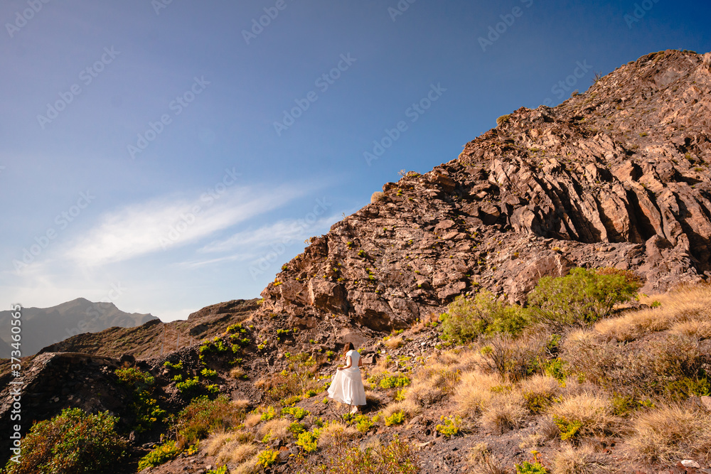 a girl in a white dress goes up a mountain a girl in a white dress goes up a mountain