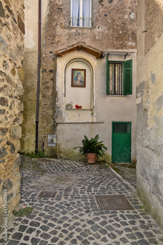 A small street between the old houses of Giuliano di Roma  of a medieval village in the Lazio region  Italy.