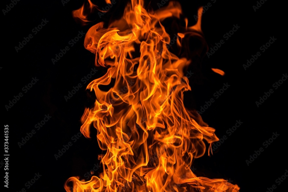 Fire flame isolated over black background, abstract texture Fire flame isolated over black background, abstract texture