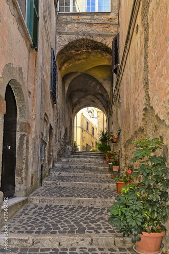 A small street between the old houses of Giuliano di Roma  of a medieval village in the Lazio region  Italy. 