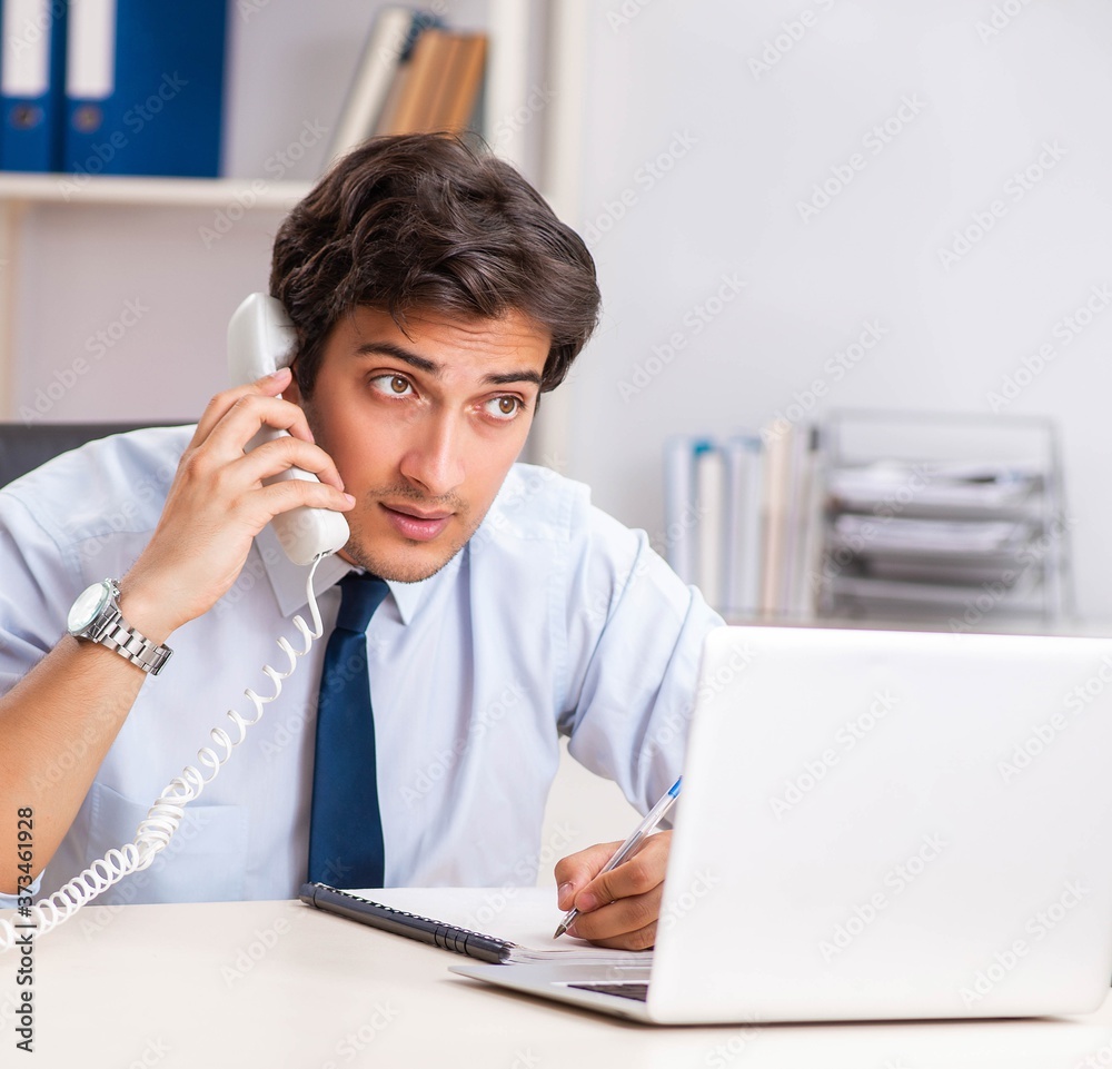 Young call center operator speaking on phone Young call center operator speaking on phone