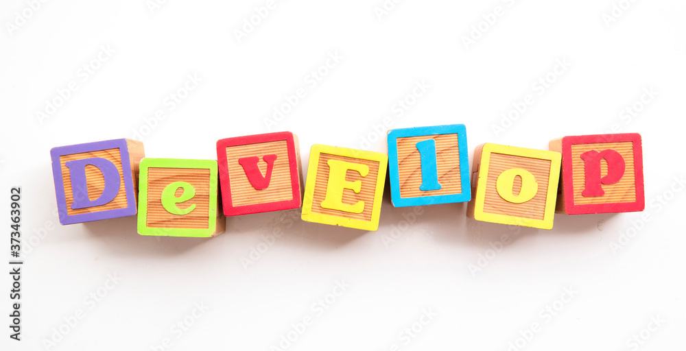 Development word made from colourful wooden baby development blocks Development word made from colourful wooden baby development blocks
