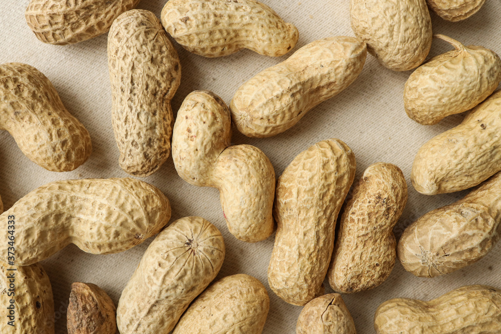 peanuts, top view, peanut fruits, peanuts on a tablecloth. food and drink concept peanuts, top view, peanut fruits, peanuts on a tablecloth. food and drink concept