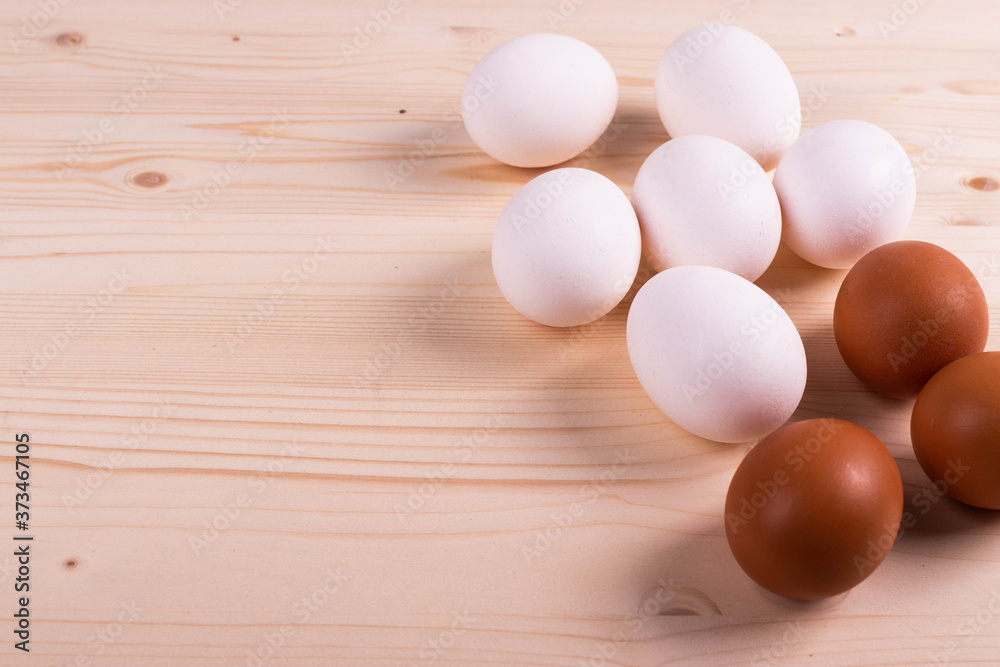 chicken raw eggs on the rustic wooden surface chicken raw eggs on the rustic wooden surface