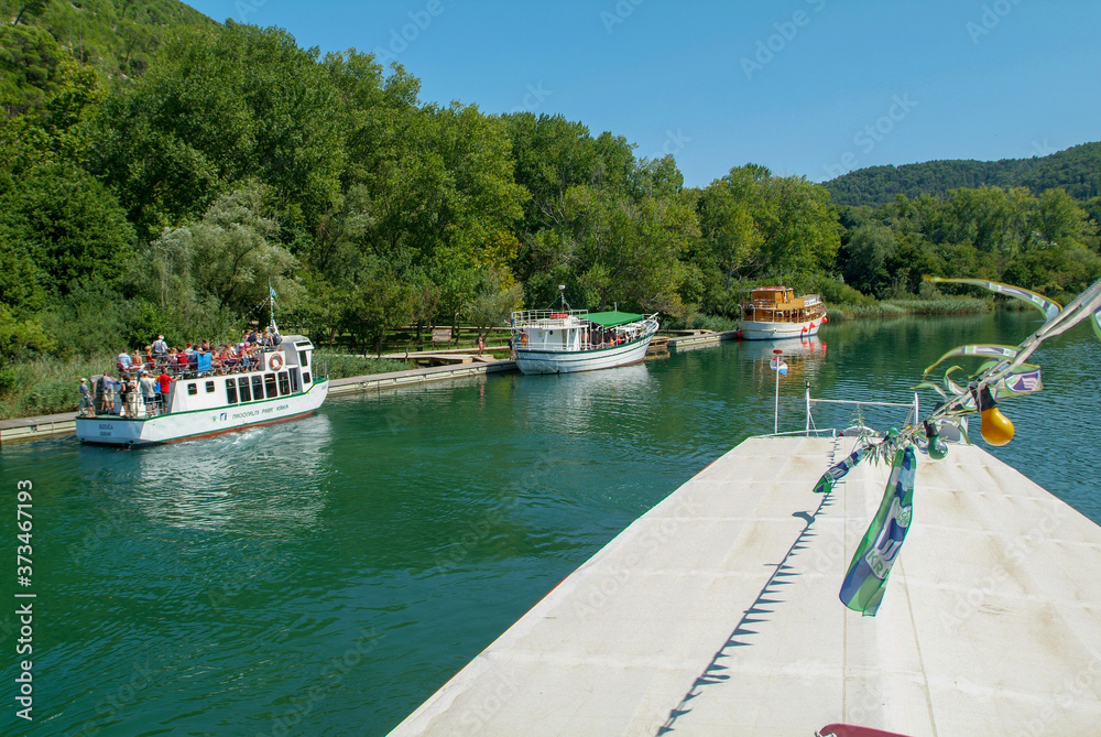 Fototapeta premium Boat at the river who takes to Krka national park on Croatia