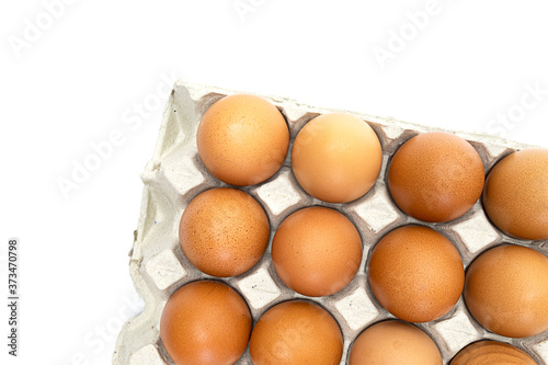 Chicken eggs in paper tray on white background. close-up. selective focus, soft focus.