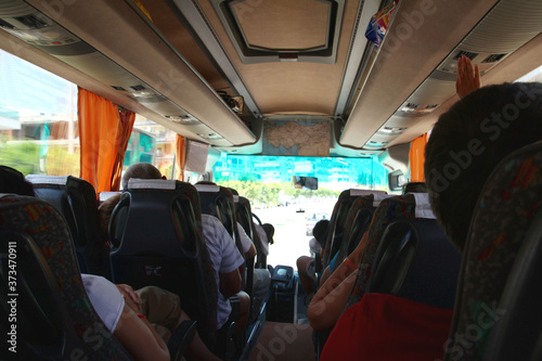 Tourists on the bus, the most accessible transport, the most common way of transportation and travel © Sergey