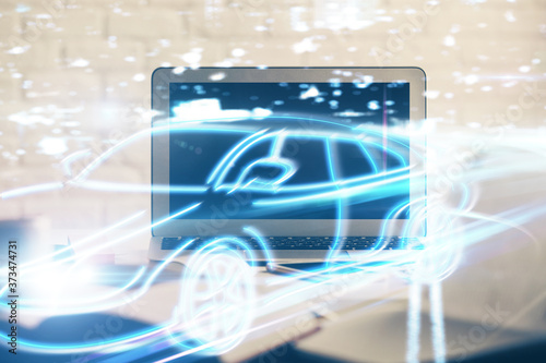 Desktop computer background in office with automobile hologram drawing. Multi exposure. Tech concept.