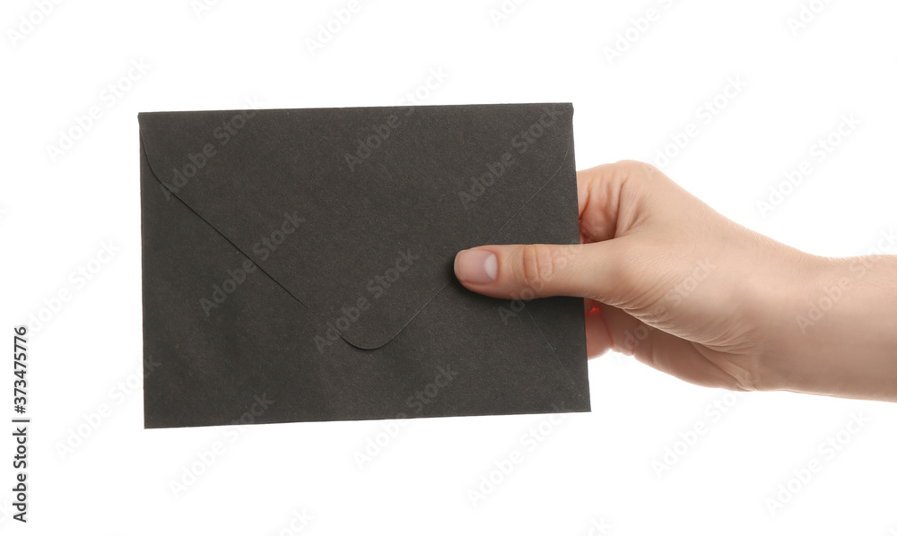 Woman holding black paper envelope on white background, closeup