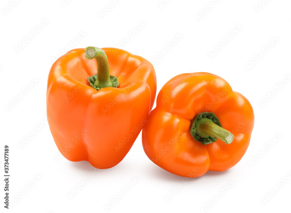 Ripe orange bell peppers isolated on white Ripe orange bell peppers isolated on white