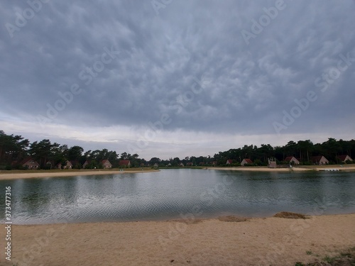 Stratocumulus clouds in the sky above a lake