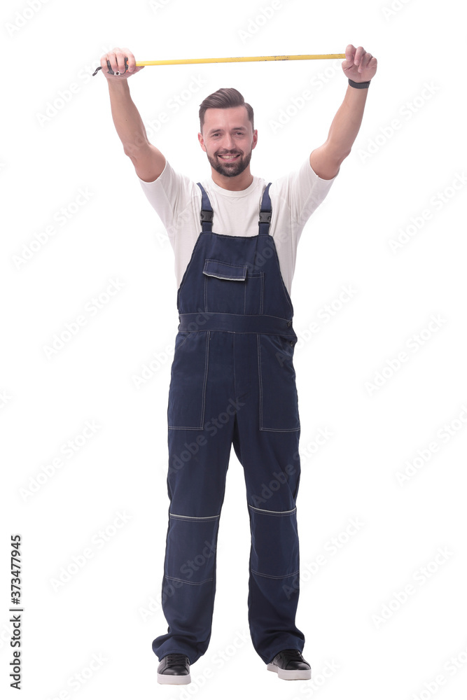 in full growth. smiling man showing construction - roulette in full growth. smiling man showing construction - roulette