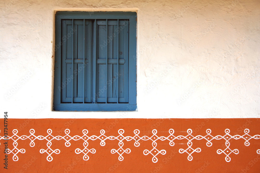 Close-up view of an old window on a red wall of Indian rural home Stock ...
