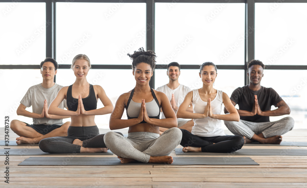 Wellness Concept. Happy Multicultural Young People Practicing Yoga In ...