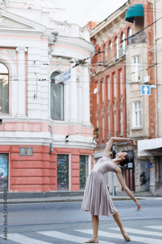 ballerina on the road in the city