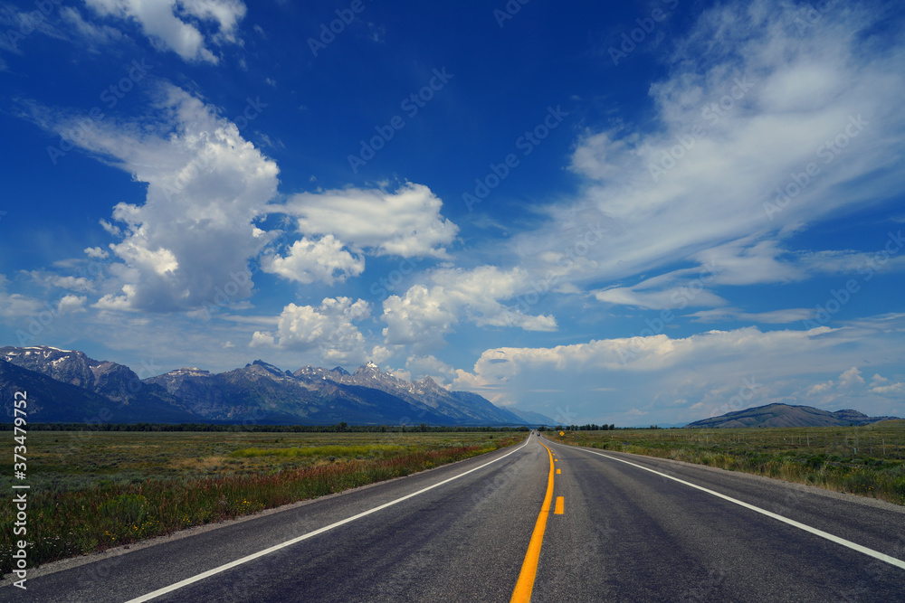 Driving on a road in summer in Grand Teton National Park in Wyoming, United States