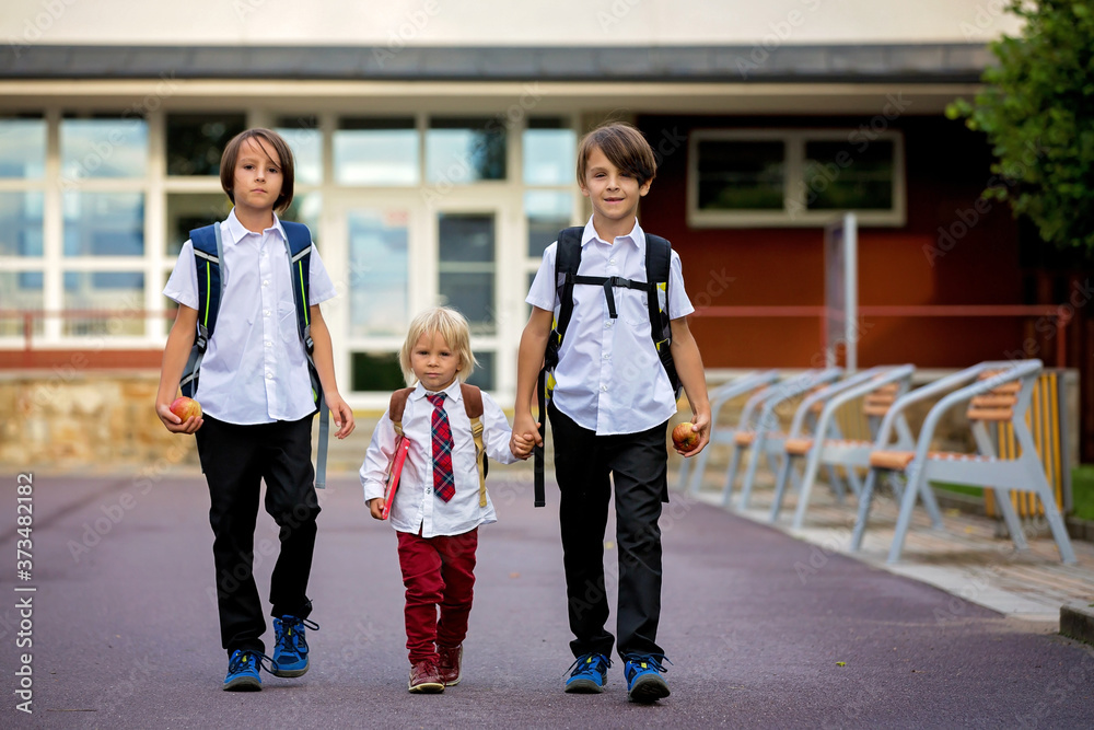 School children, boys, going back to school after the summer vacation School children, boys, going back to school after the summer vacation
