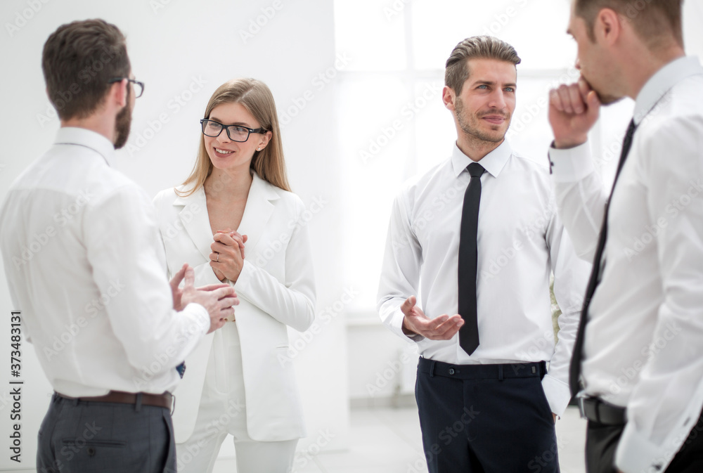 smiling colleagues discussing new ideas. smiling colleagues discussing new ideas.
