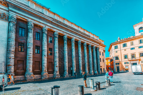 ROME, ITALY - MAY 09, 2017 : The Temple of the Divine Adrian( Il Tempio di Adriano) with people on Stone Square(Piazza di Pietra). Rome. Italy. photo