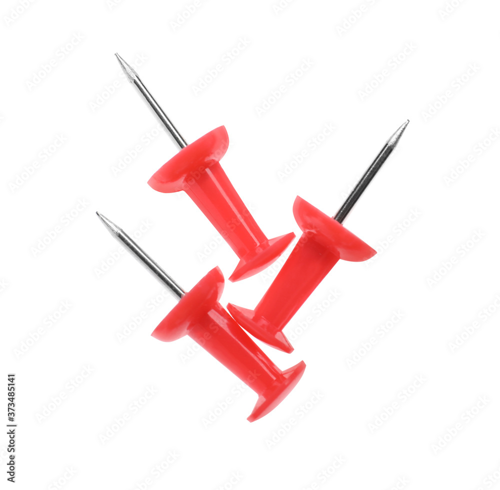 Colorful drawing pins isolated on white, top view. School stationery Colorful drawing pins isolated on white, top view. School stationery