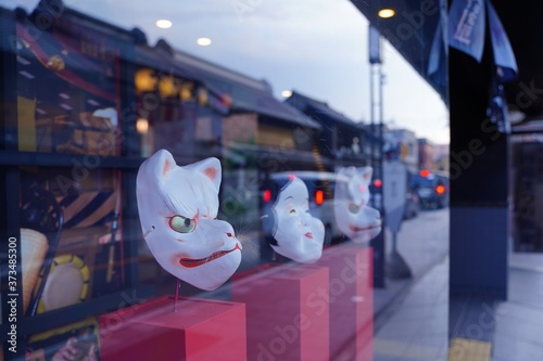Japanese old style fox and okame face masks are in show window in Kawagoe, old edo town, Japan. photo
