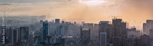Chengdu, Sichuan province, China - Aug 19, 2020 : Chengdu backlight skyline panorama aerial view with clouds on the city