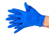 Hands of a medic wearing a blue latex gloves, white background.