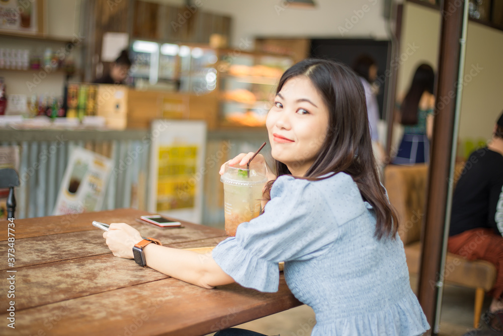 Beautiful women drink ice soda tea in cafe Beautiful women drink ice soda tea in cafe