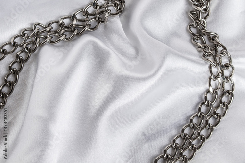 luxury white wavy silk texture with frame of chain background