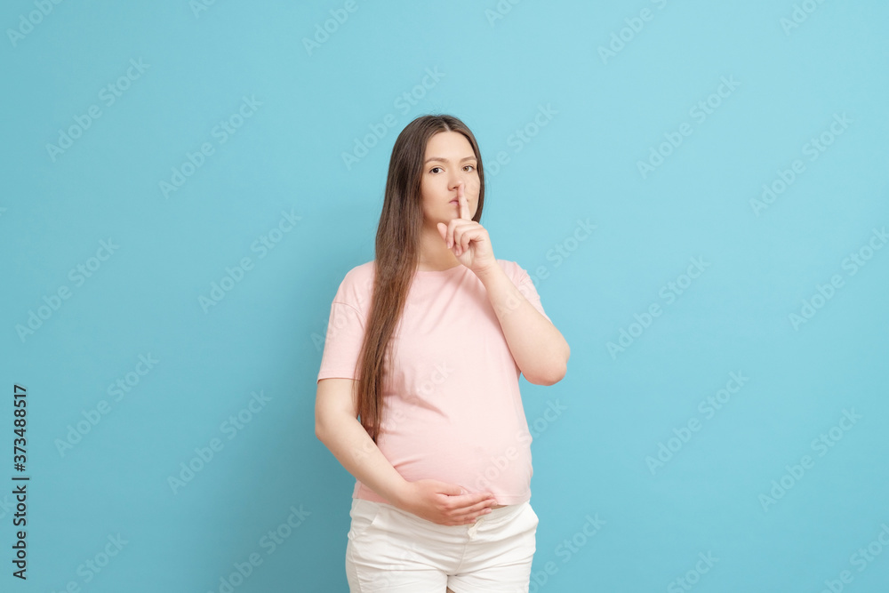 beautiful young pregnant woman asks not to make noise beautiful young pregnant woman asks not to make noise